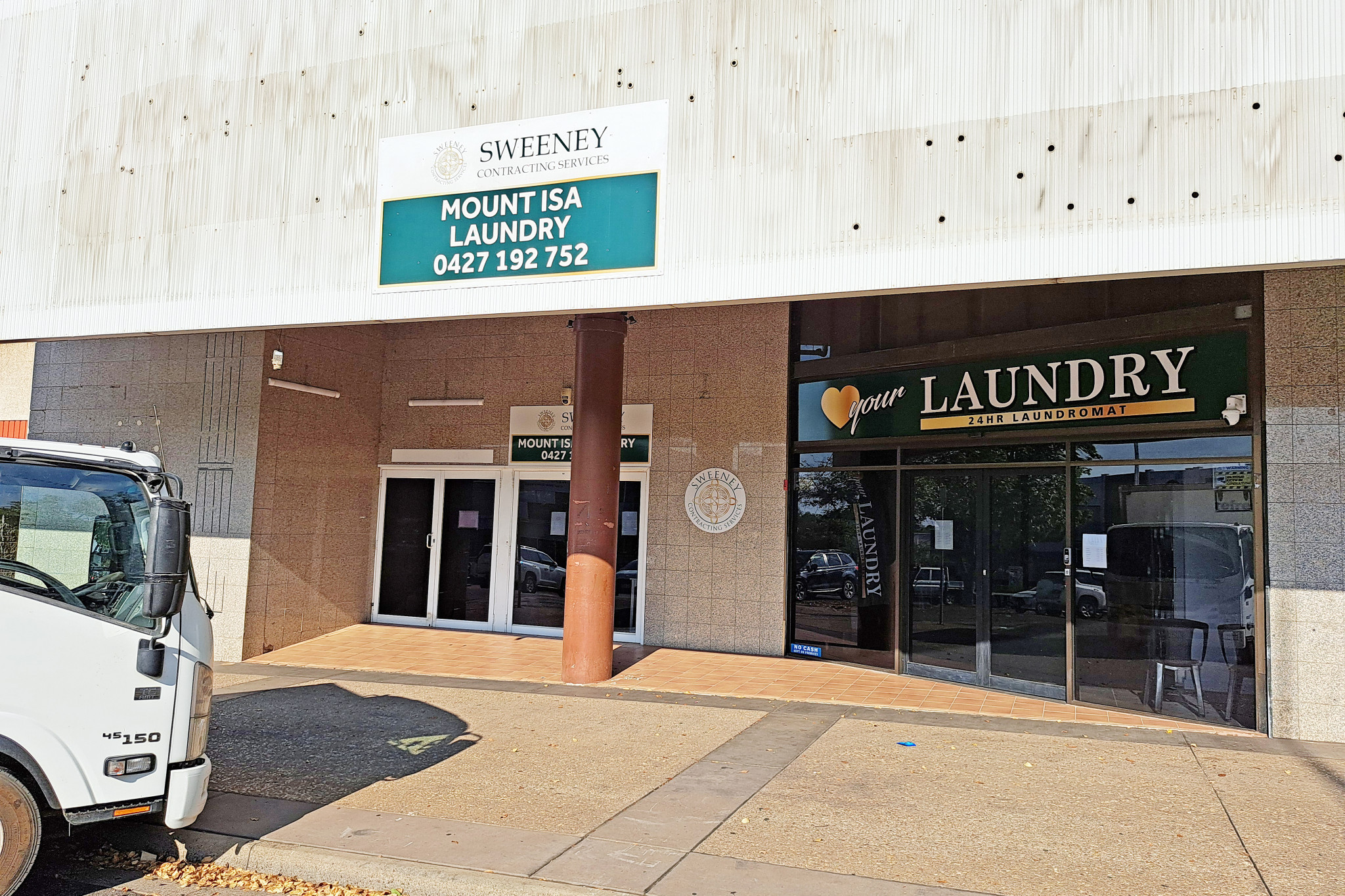 Once a nightclub and formerly a furniture and electrical good store, this Miles Street premises now contains a commercial laundry and laundromat.