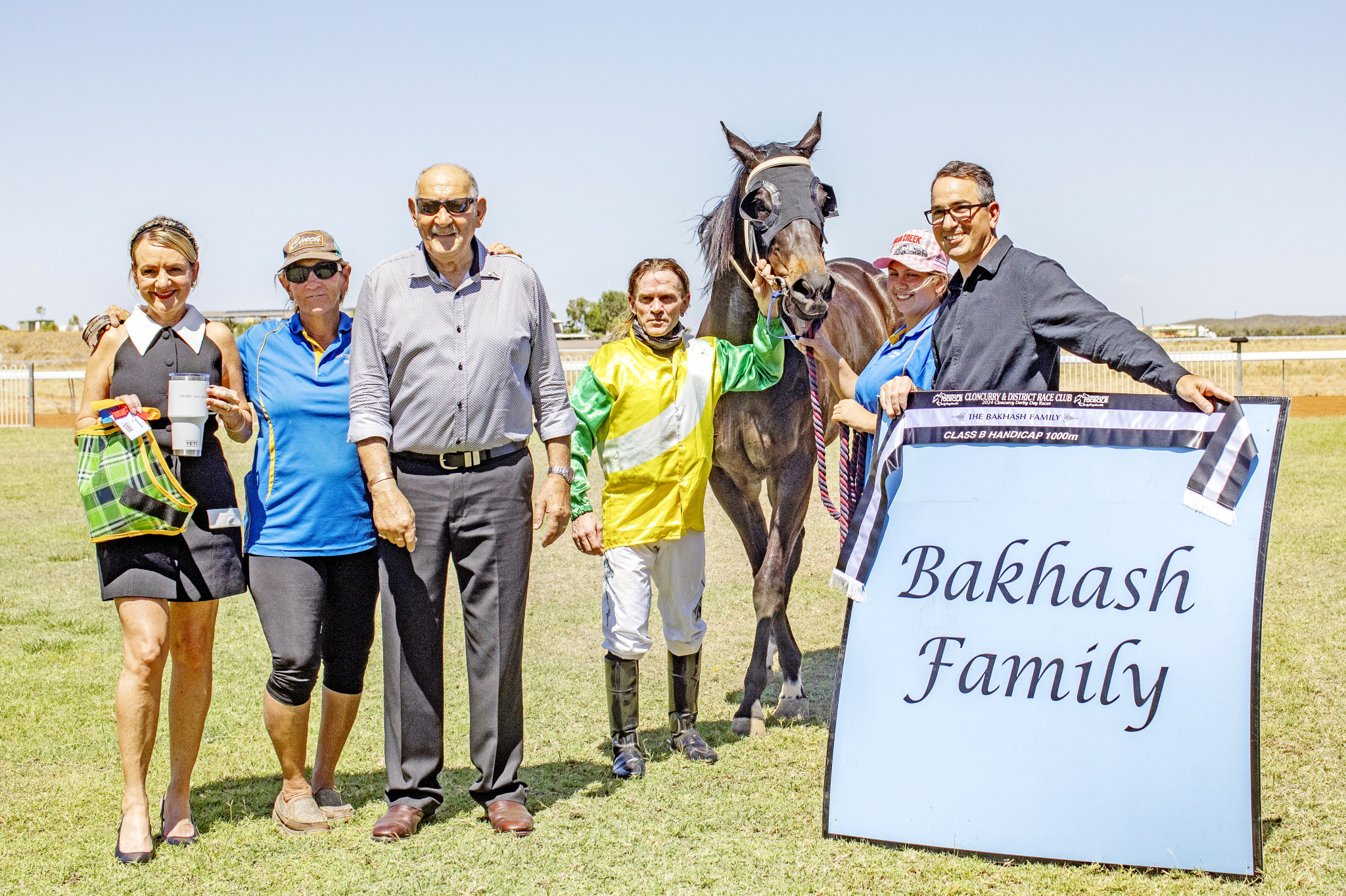 Trainer Shryn Royes, jockey Jason Hoopert and members of the Bakhash family.