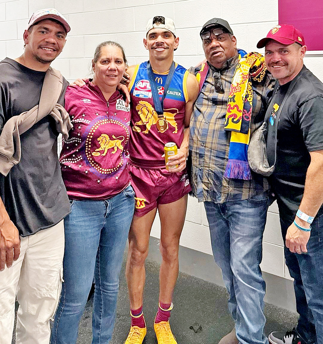 Charlie in th change rooms with his family who made the trip to Melbourne.