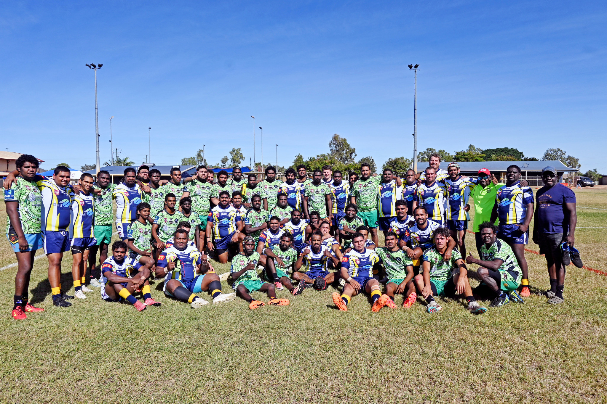 The Kowanyama and Normanton players unite for a photo after their match to kick off Saturday’s proceedings.