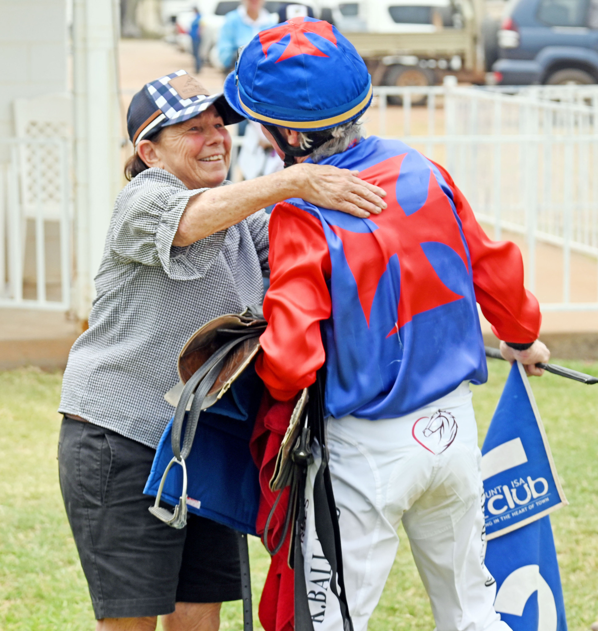 Denise Ballard prepares to give Keith a hug after his win aboard Metal Bar.