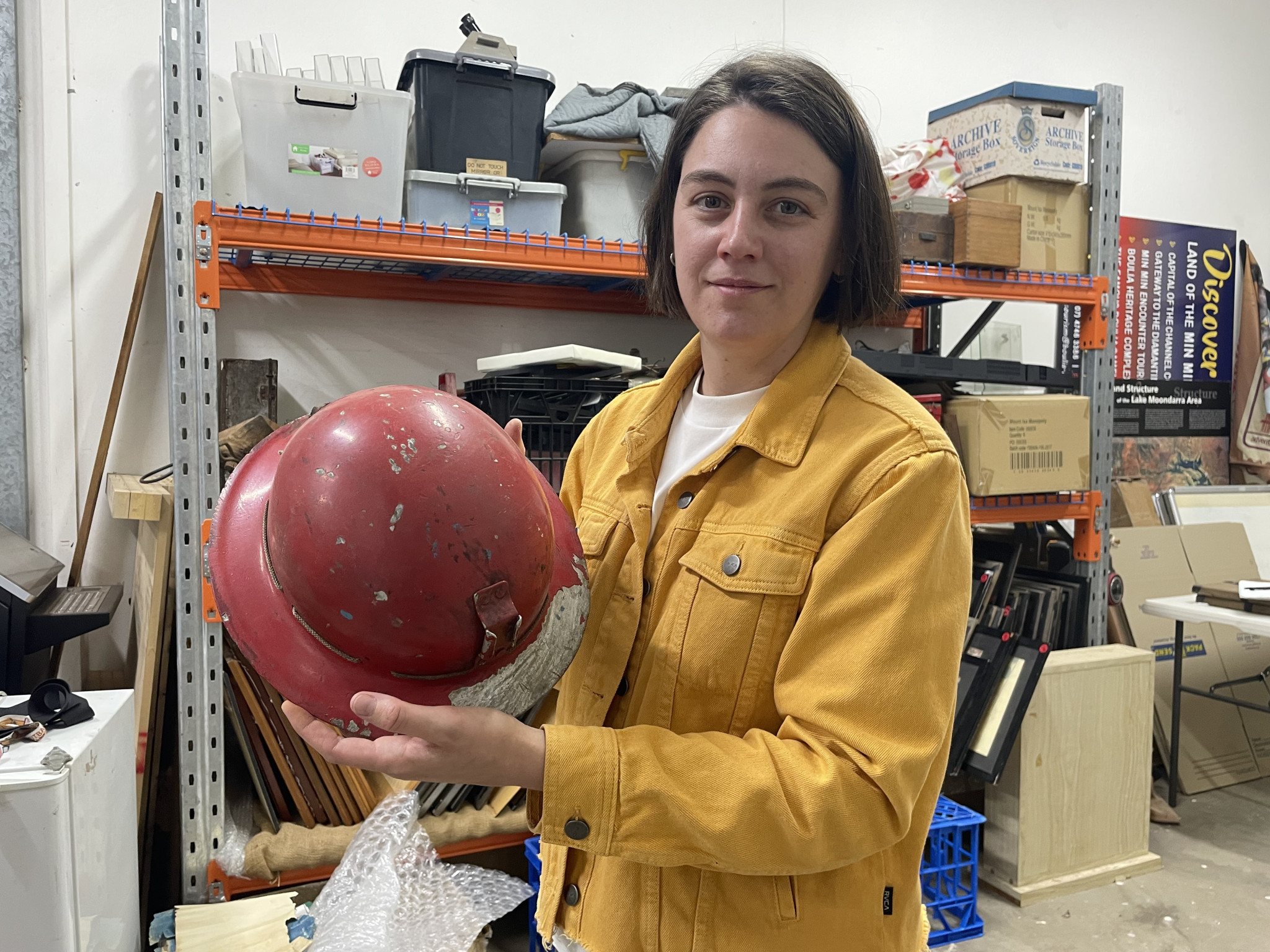Daria Gradusova with a helmet said to be among the first used at Mount Isa Mines.