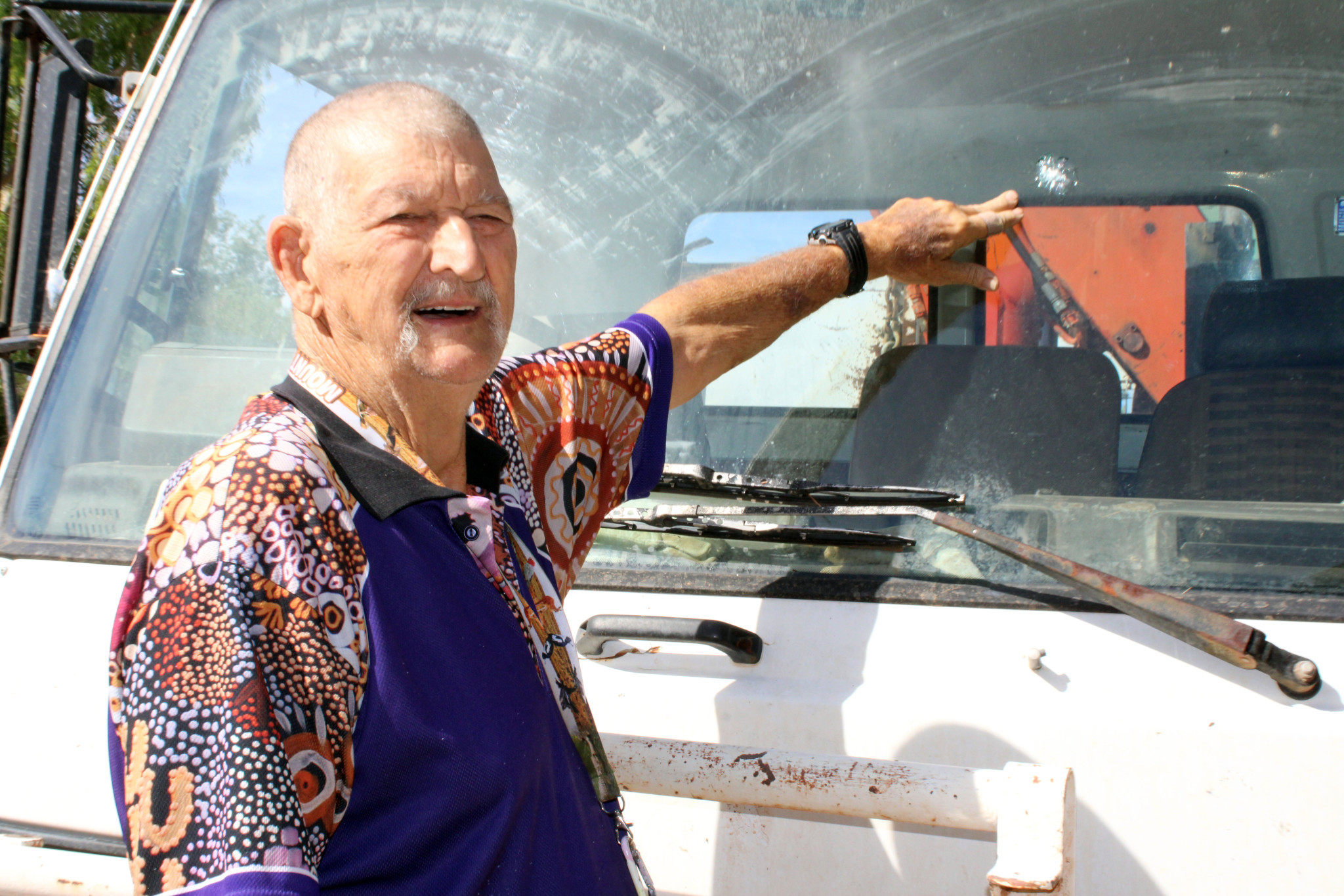 Alan Rackham points out windscreen damage caused by youths at Outback at Isa.