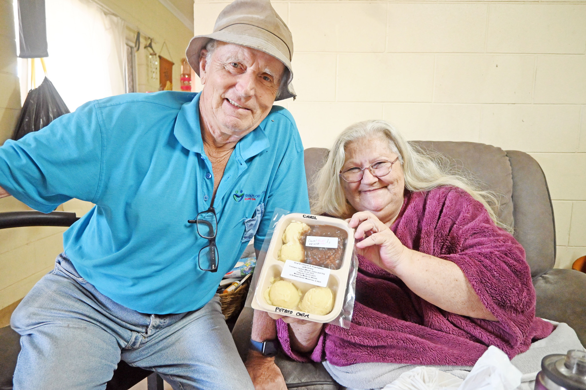 Volunteer Erwin Raffetseder enjoys a chat with client Carol Kenna.
