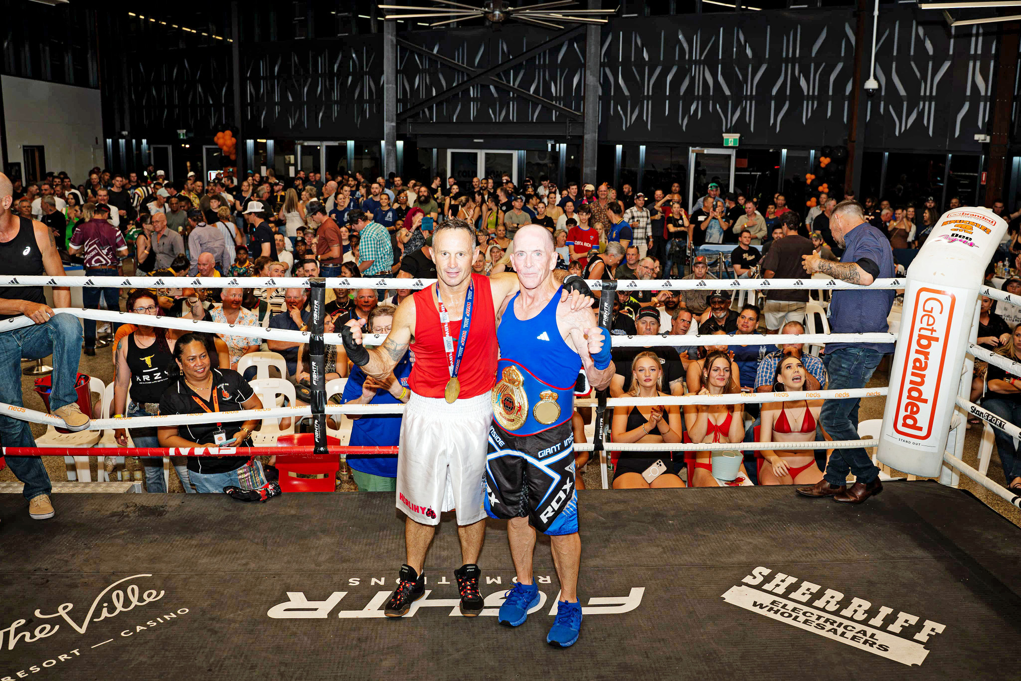 Allan Hazle (right), pictured with contender Joel Herlihy, will bring his title belt back to Mount Isa after successfully defending his World Masters Welterweight crown in Townsville on Saturday night.