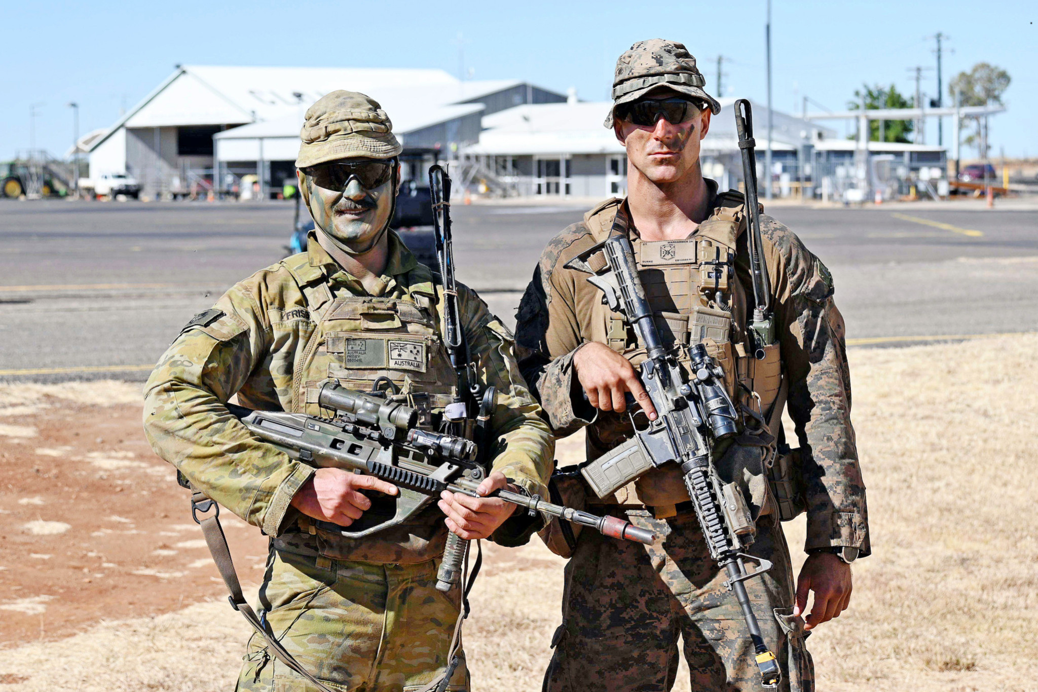 Australian Army Major Jamie Frisby and US Marine 1st Lieutenant Max Burke pose during Talisman Sabre training at Cloncurry Airport. Picture: Seth Robson via stripes.com, All Rights Reserved