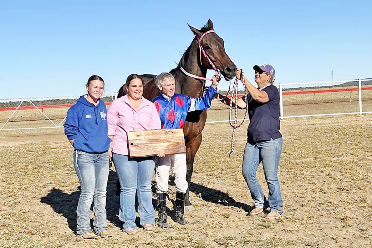 Jockey Keith Ballard and trainer Tanya Parry (right) combined with Texas Storm to win the Hughenden Cup on Saturday.