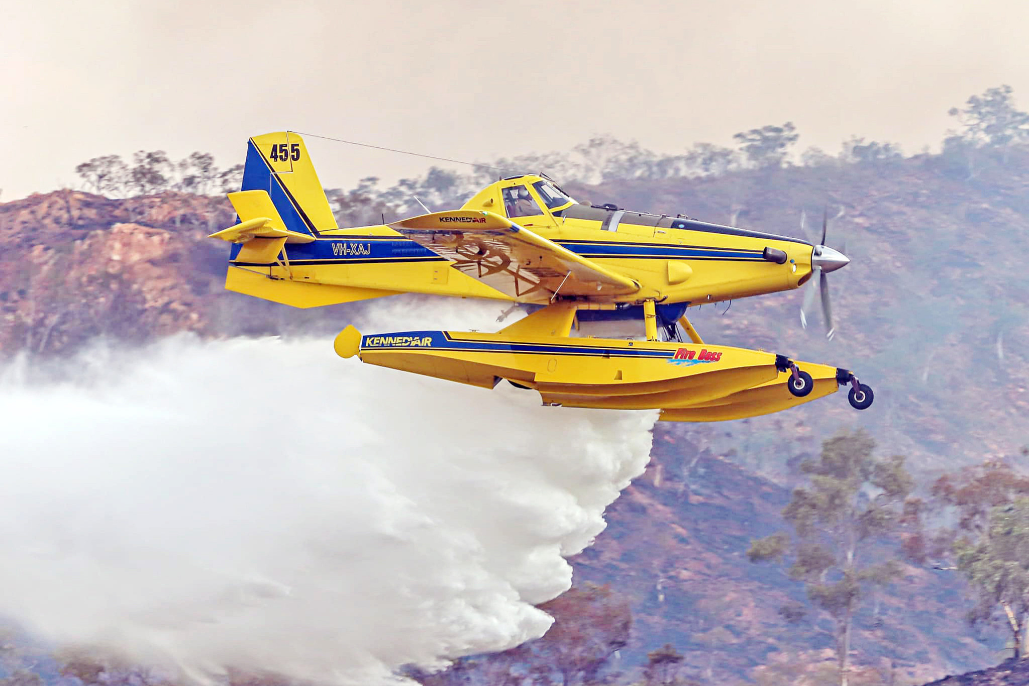 This Kennedy Air Fire Boss-455 made dozens of trips between Lake Moondarra and the fire front to help extinguish the blaze impacting several private properties. Picture: Mount Isa Aviation Photography