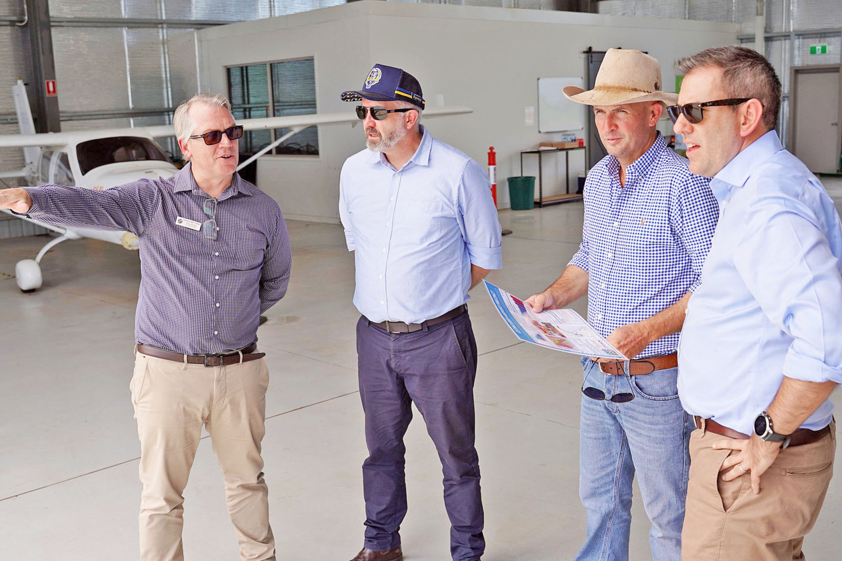 Cloncurry Shire CEO Philip Keirle, Senator Anthony Chisholm, mayor Greg Campbell and Treasurer Jim Chalmers at the airport.