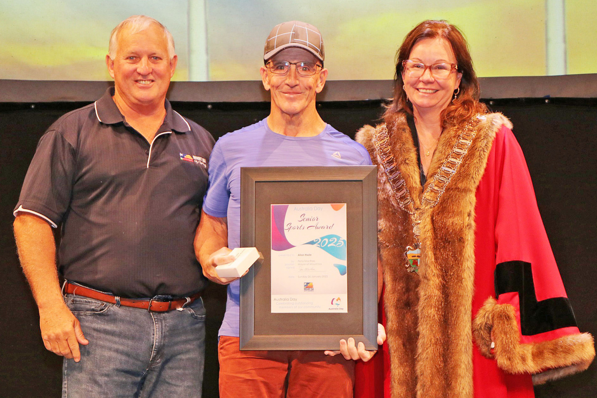 Mount Isa councillor James Coghlan and mayor Peta MacRae with Allan Hazle, who was named a co-winner of the Seniors Sports Award at the council’s Australia Day Awards on January 26.