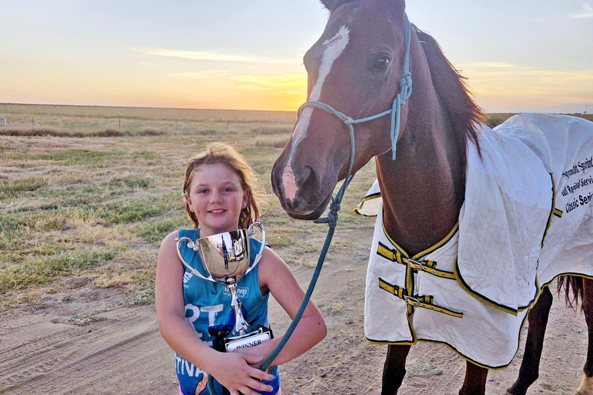Proud ‘assistant trainer’ Ella Gallagher with the Merrie Elliott Breeders Cup after Mr Hanky Panky’s victory.