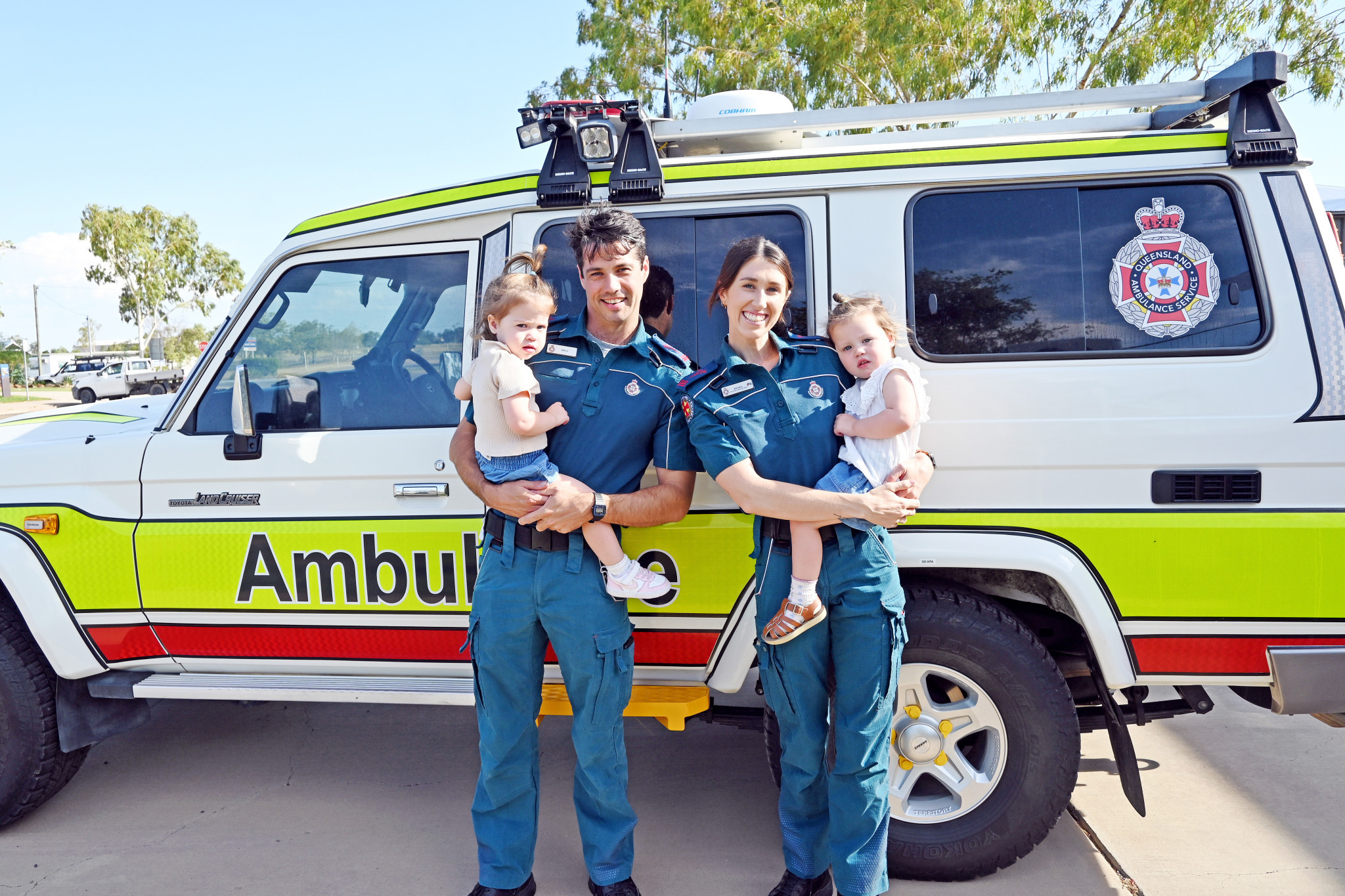 Billy Wootton and Kelsea Hogan and their twin girls Goldie and Delilah at the Julia Creek ambulance station, where they both work as full-time paramedics.