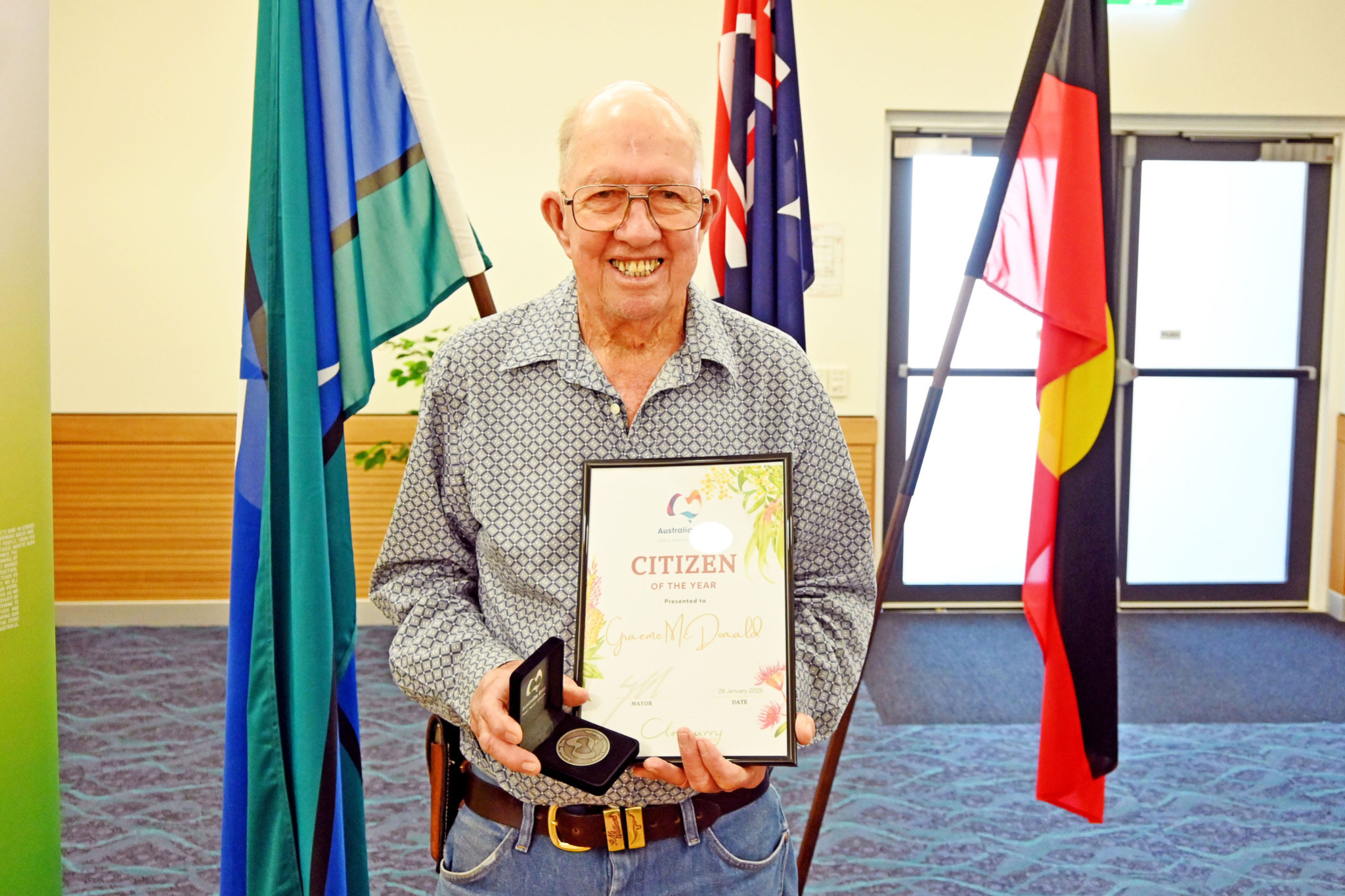 Cloncurry postie Graeme McDonald had a big grin on his face when he was named the shire’s Citizen of the Year.