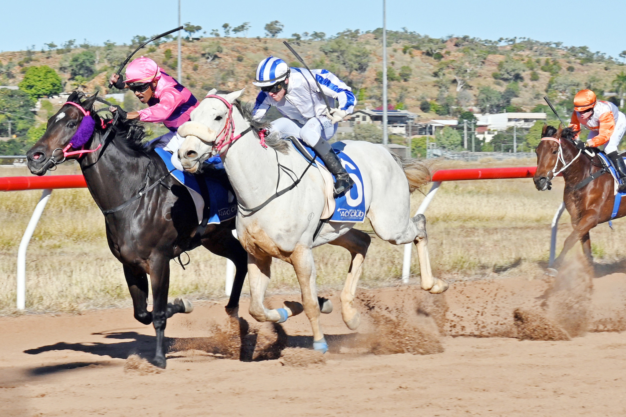 Terrence Hill on Dollson (inside) fends off Corey Bayliss on Caffrey in the Mount Isa Cup. Boxing on for third place was apprentice Chloe Lowe on Le Force.