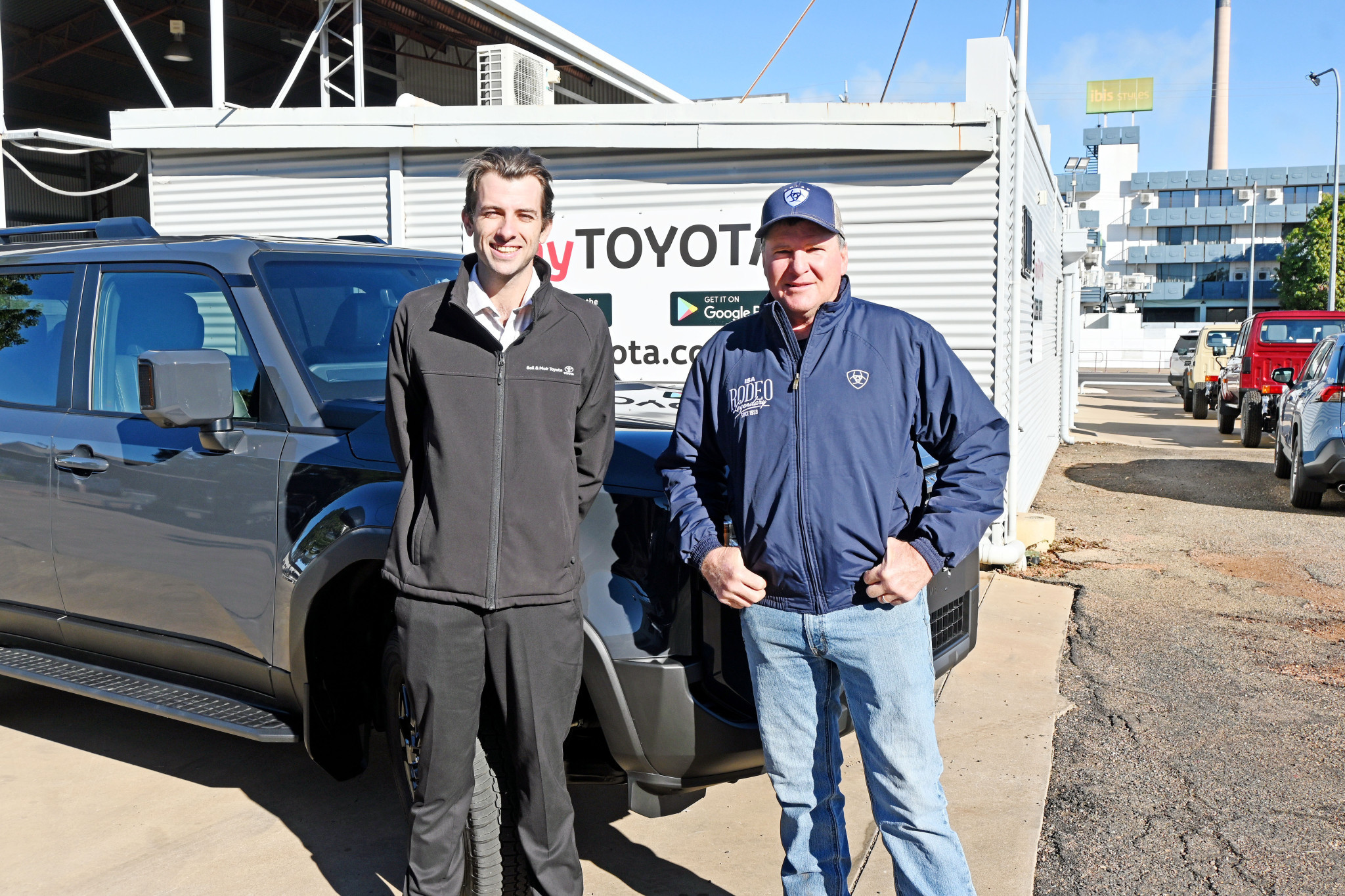 Aaron Pulman from Bell and Moir Toyota with Mount Isa Mines Rodeo chairman Mark Thompson to launch ticket sales in the Art Union Prize Draw.