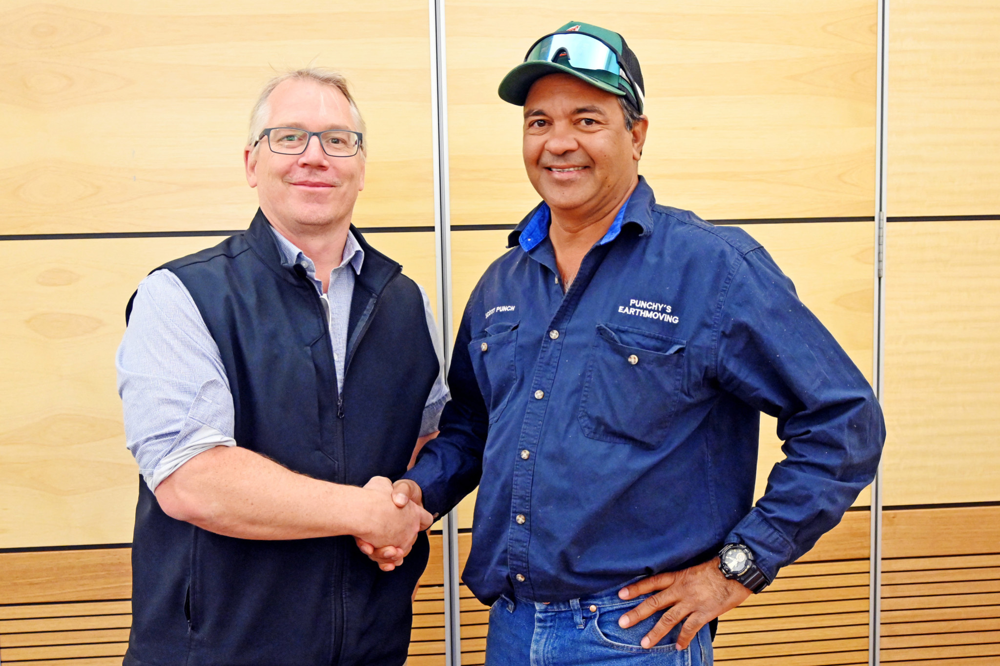 Cloncurry Shire Council CEO Philip Keirle congratulates Dajarra business owner Scott Punch for snapping up a bunch of Jimberella properties at last week’s auction, keeping them in local hands.