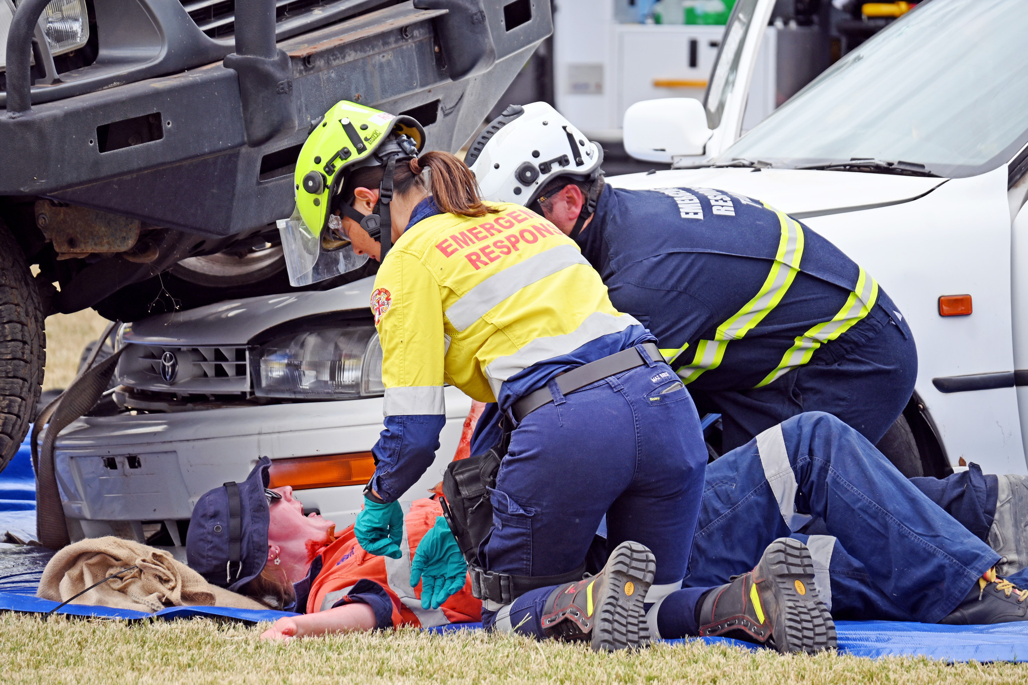 A 'patient' is given first aid at the mock crash site at the Cloncurry Recreation Grounds.