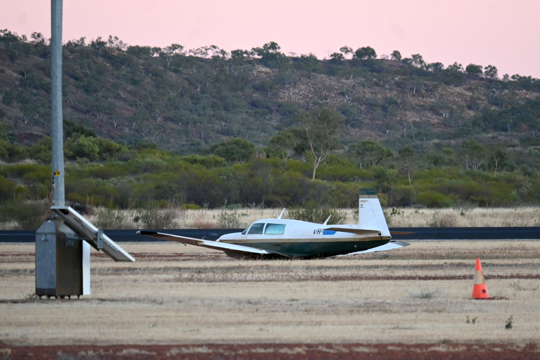 Robbie Katter's Mooney M-20 sits next to the runway at Mount Isa Airport.
