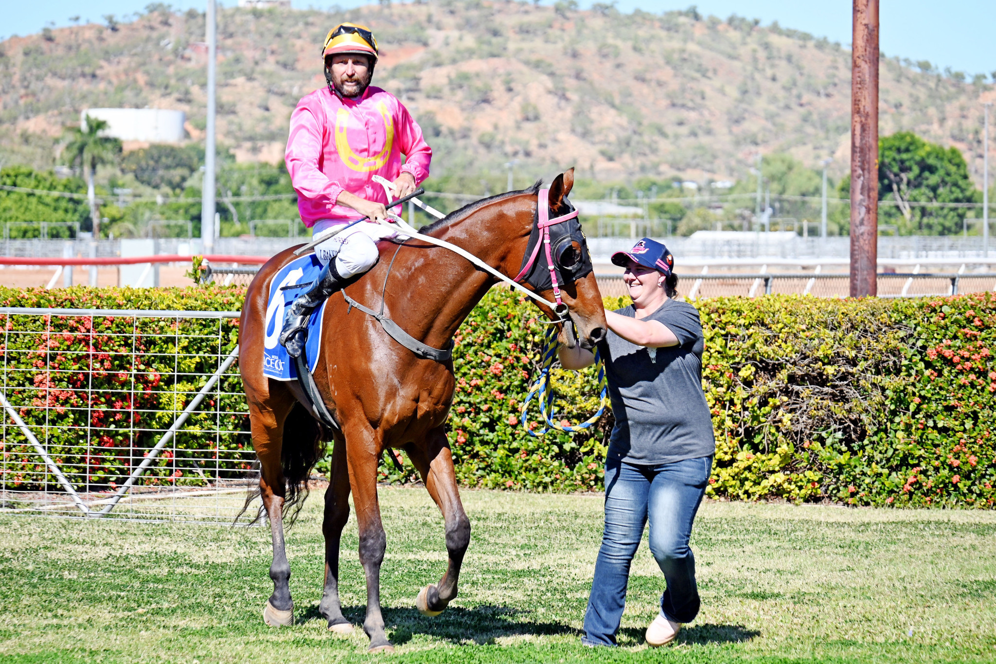 An elated Holly Robertson with jockey James Baker and three-year-old gelding Mishani Eagle at Buchanan Park.