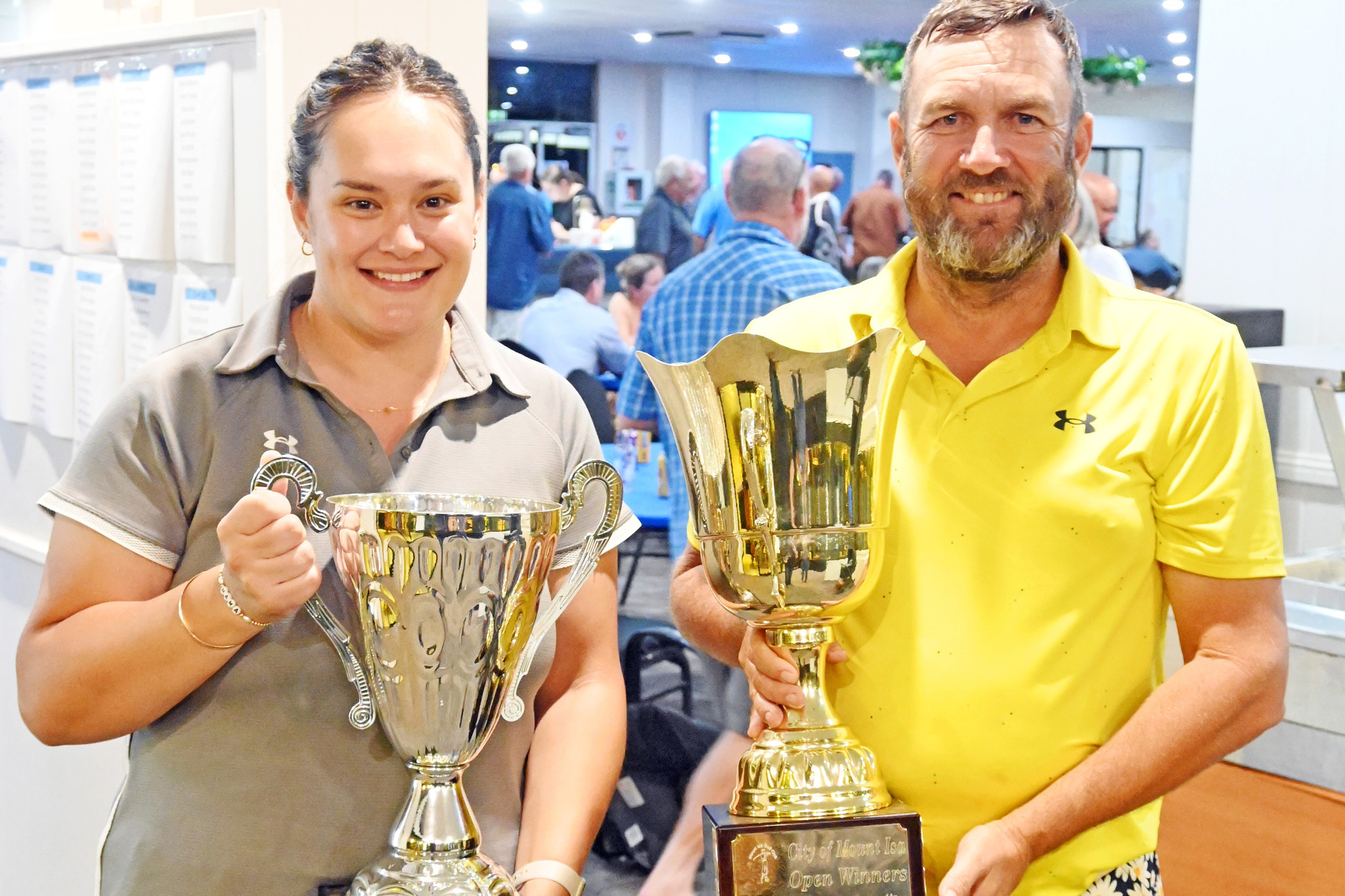 City of Mount Isa Open women’s champion Kate Chadwick with men's champion Scott Sibson.