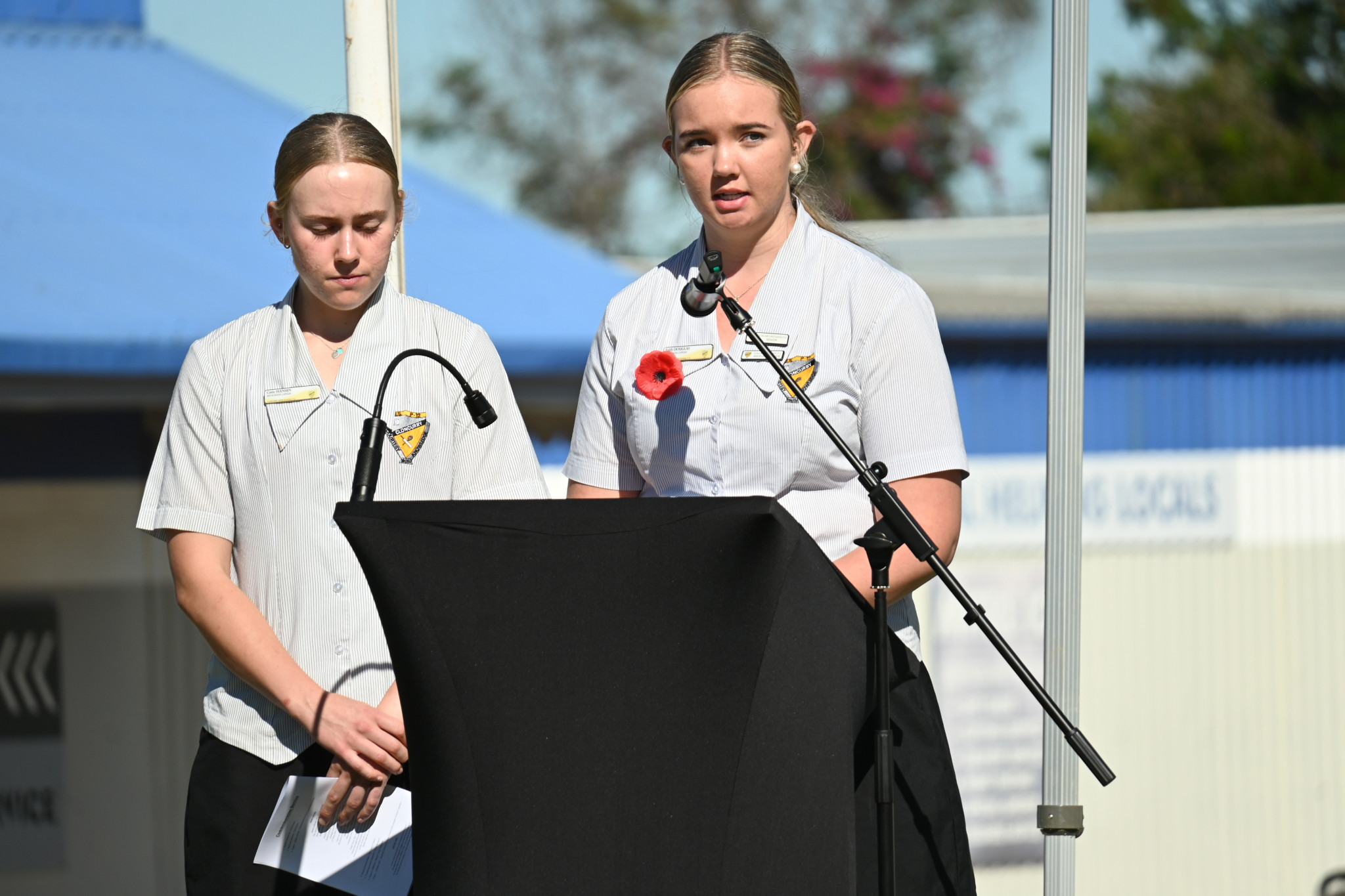 Cloncurry State School captains Catie Hansen and Faith Douglas read a poem at the Cloncurry Anzac Day service.