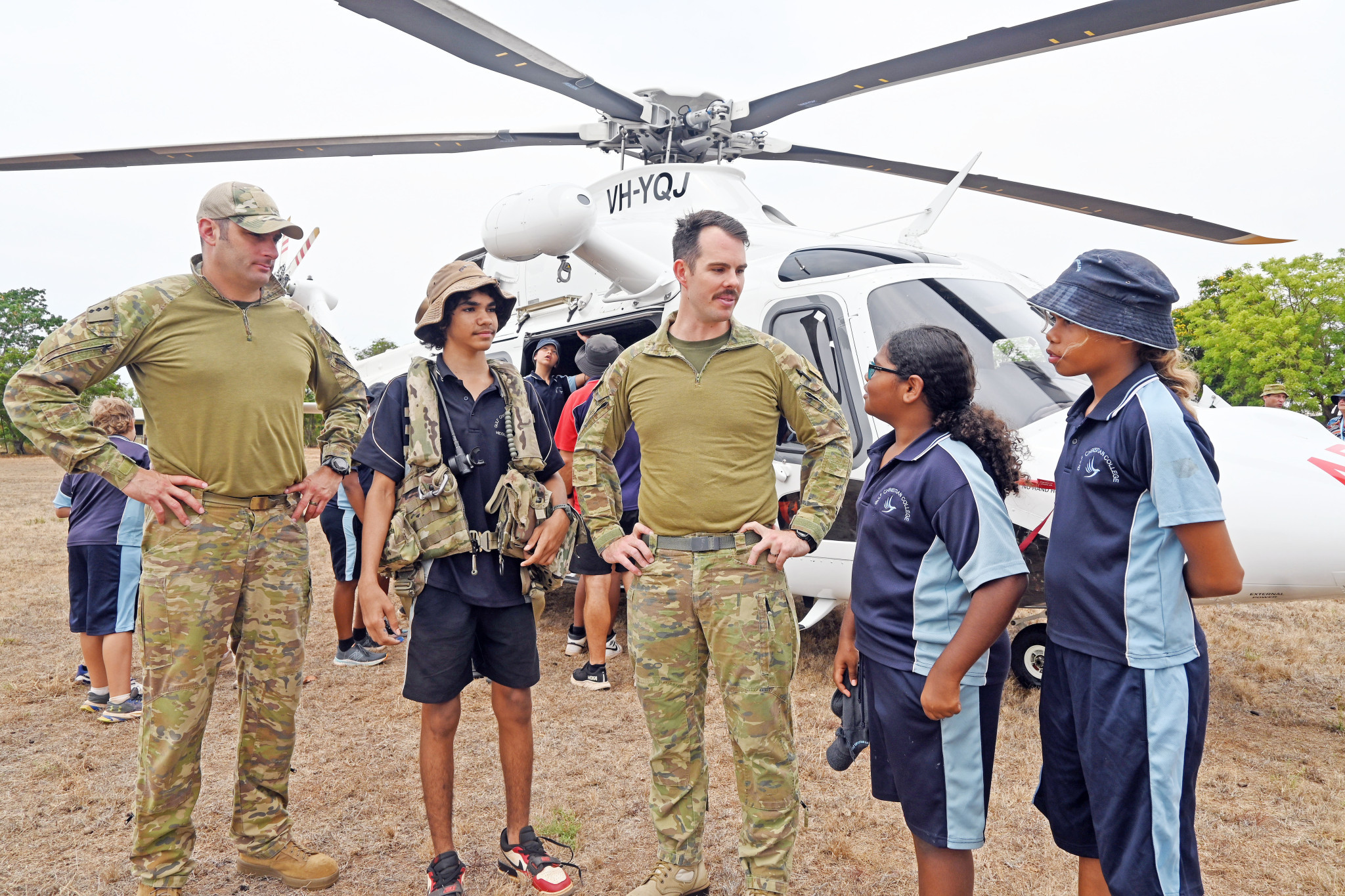 Army pilots, Captain Timothy Oke and Captain Michael Jones, with Normanton students Nathaniel Bee, April Walton and Mylee Bee.