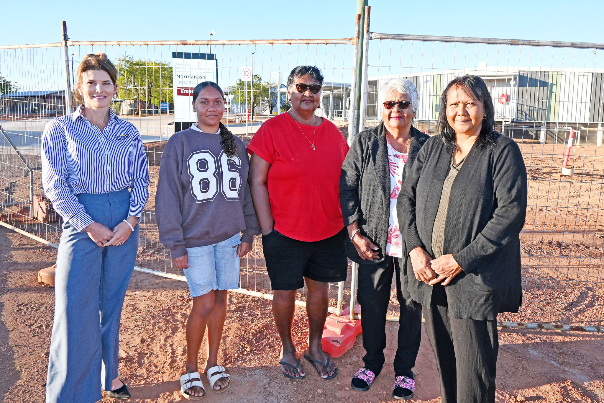 Standing in front of the new Normanton Hospital last Friday – Carpentaria Shire councillor Cherie Schafer with family members of Townsville-based dialysis patient Gibson Charger – Rekia Beasley, Michelle Charger, Joy Murray and Sharon Charger. They say they are thrilled that Gibson will be able to return home next year.