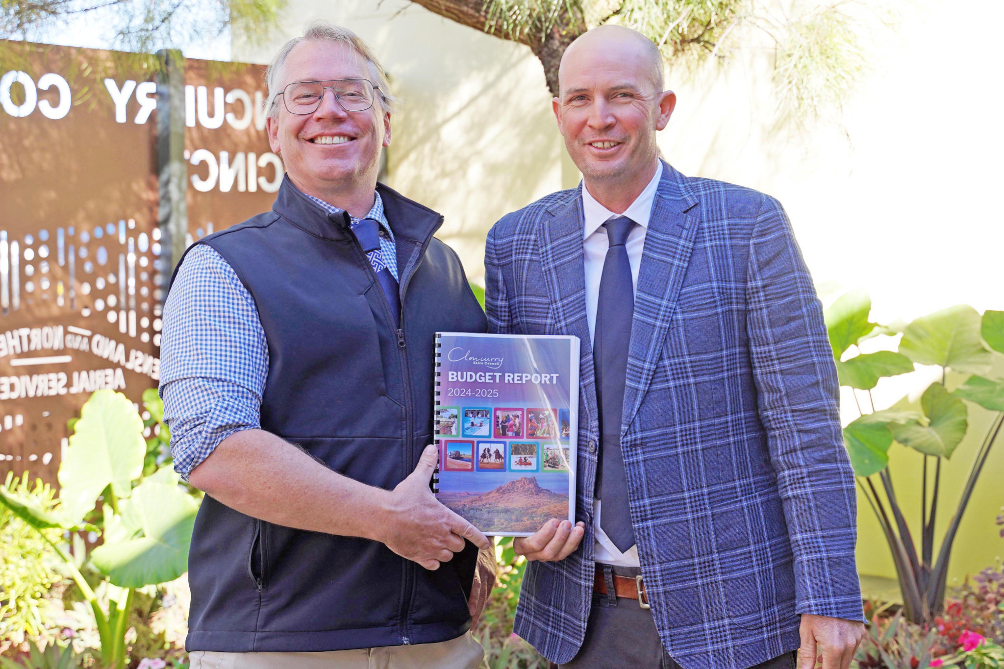 Cloncurry Shire Council CEO Philip Keirle and mayor Greg Campbell with a copy of the 2024-25 budget report that was handed down last week.