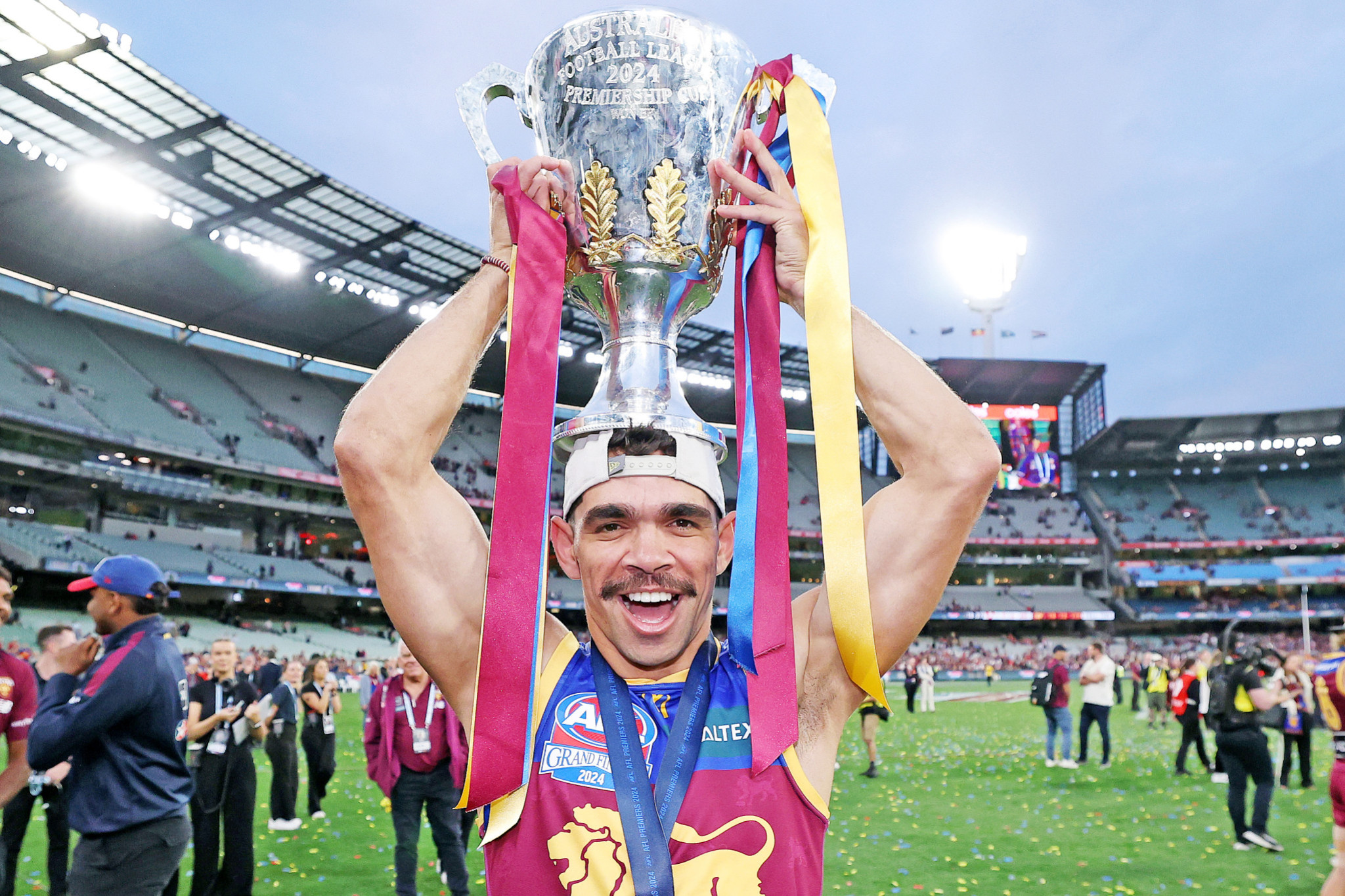 Charlie Cameron holds the premiership cup aloft on the hallowed turf of the MCG.