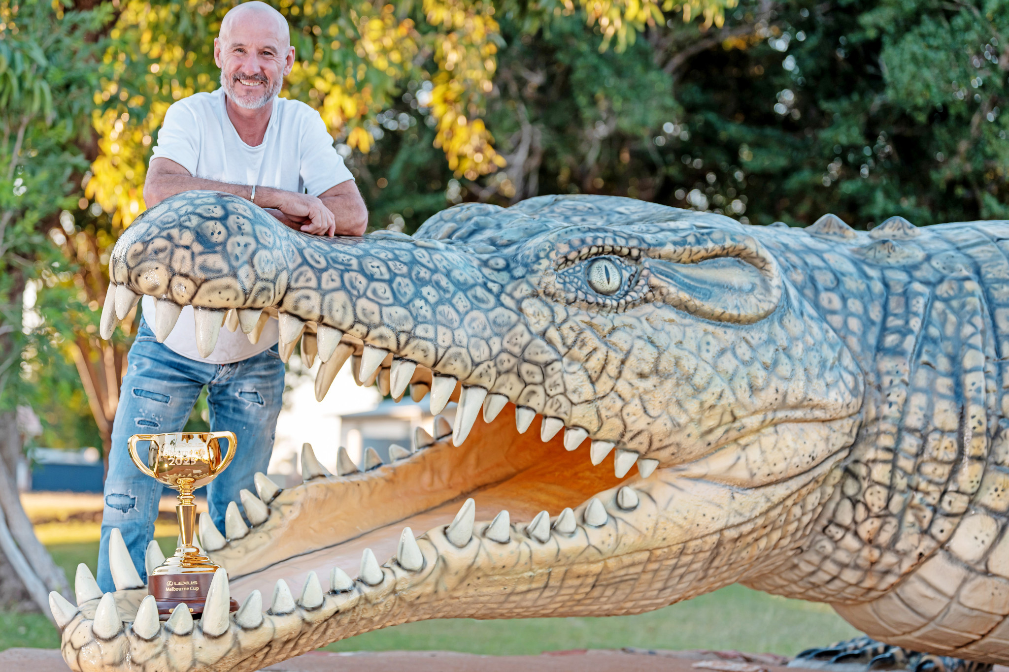 Legendary jockey Glen Boss with Krys the croc in Normanton last week as part of the Lexus Melbourne Cup’s official 2025 tour.