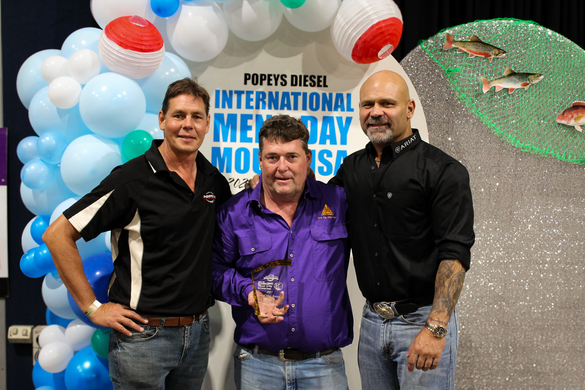 John Davis, centre, won the Local Hero Award. He's pictured with Adrian Pope and Shane Matthews.