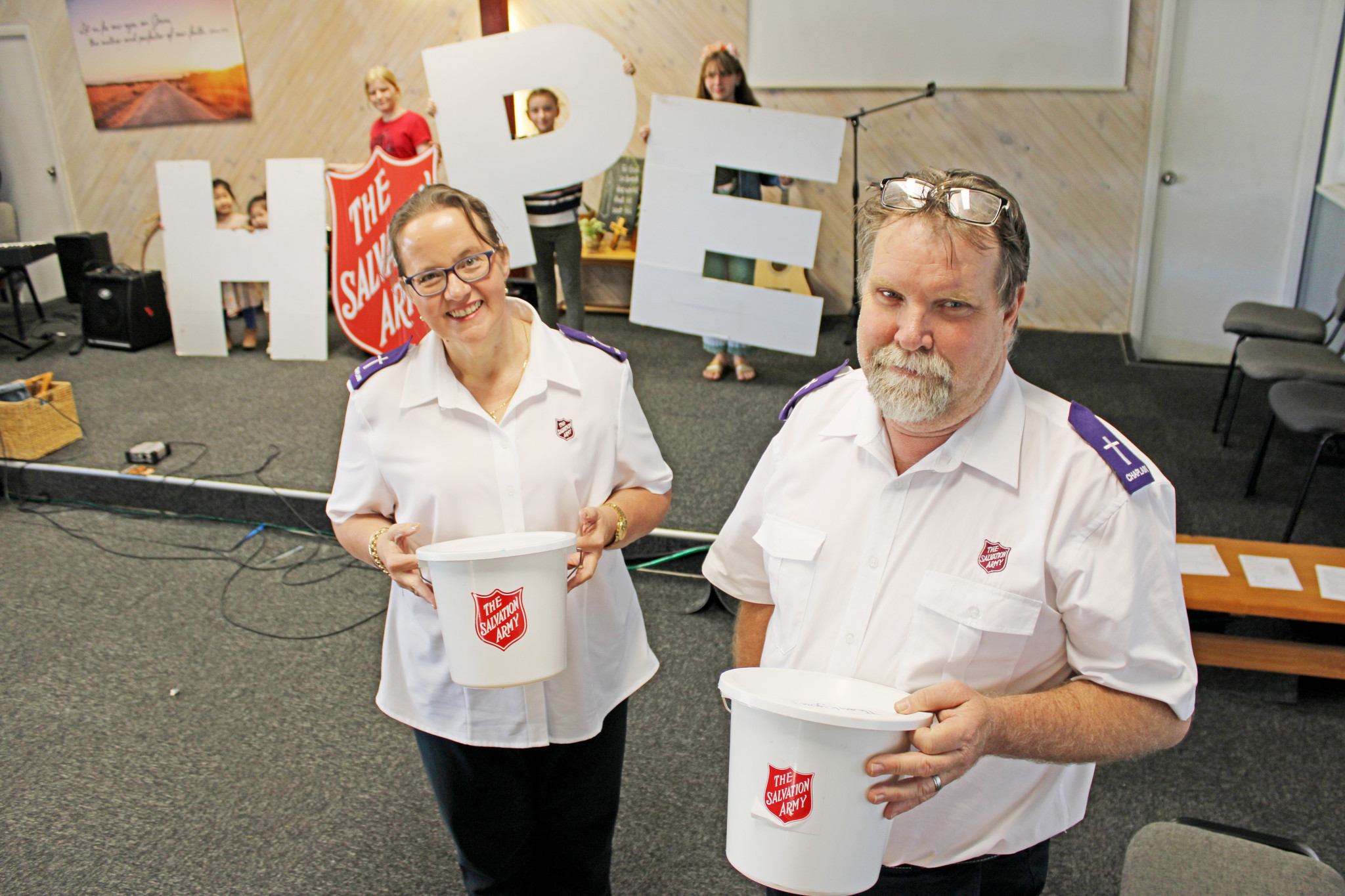 Mount Isa Salvation Army Chaplains Evelyn and Glen Charles are bringing some hope to the city through the annual Red Shield appeal. Assisting them are youngsters Joy and Ruth Yen, Sylvie Bower, Pascale Bower and Emily Doran.