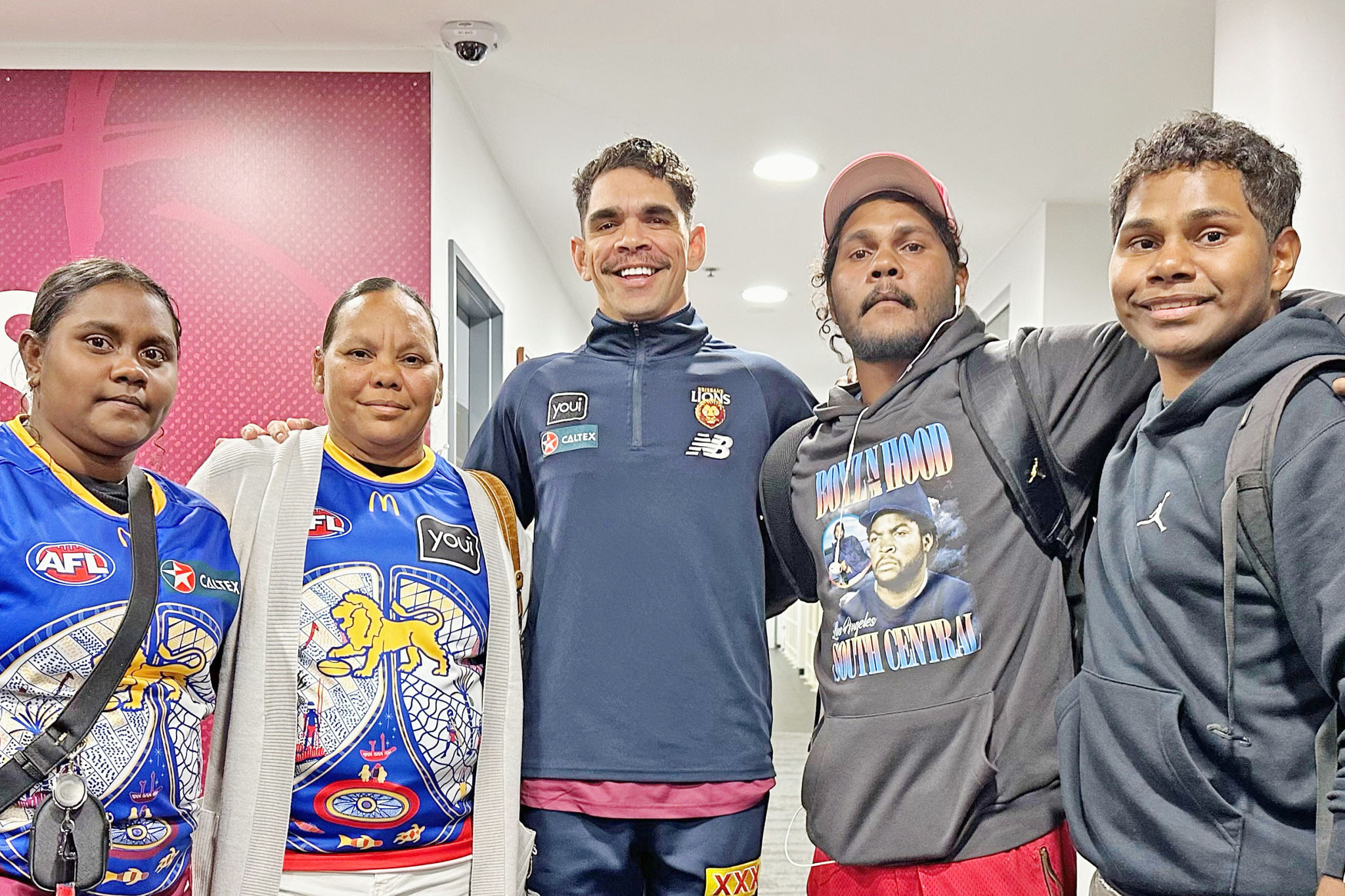 Brisbane Lions star Charlie Cameron (centre) with Mornington Island’s Yalul Toby, Renee Wilson, Murrawu Toby and Mangubudkija Toby at the Gabba in May this year.