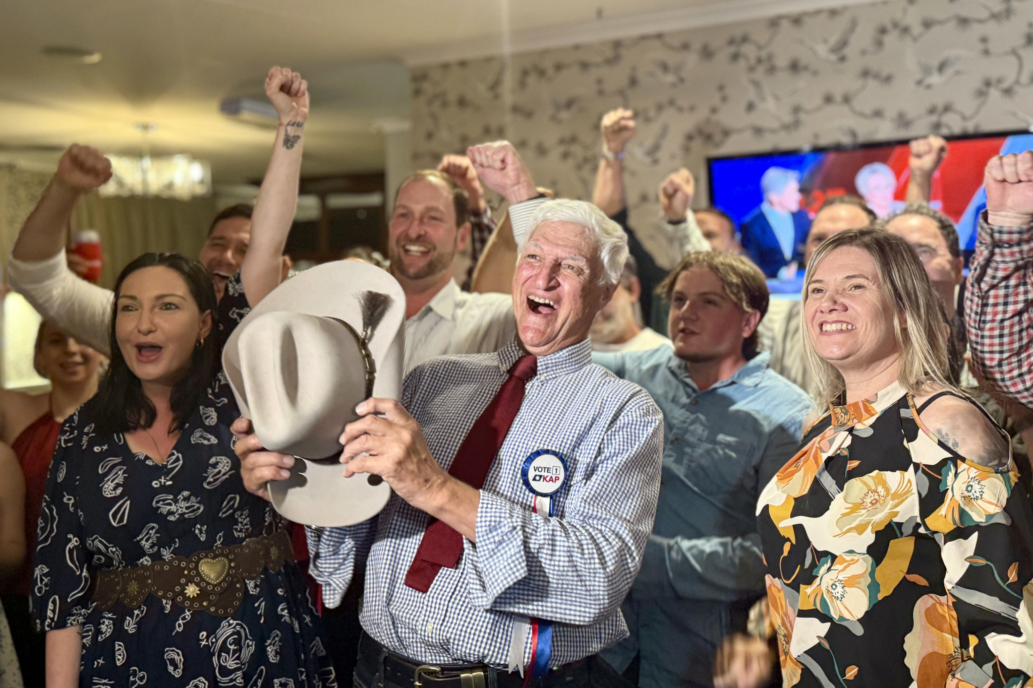 Bob Katter celebrates with family and friends after he was returned as the Member for Kennedy in Saturday’s federal election.