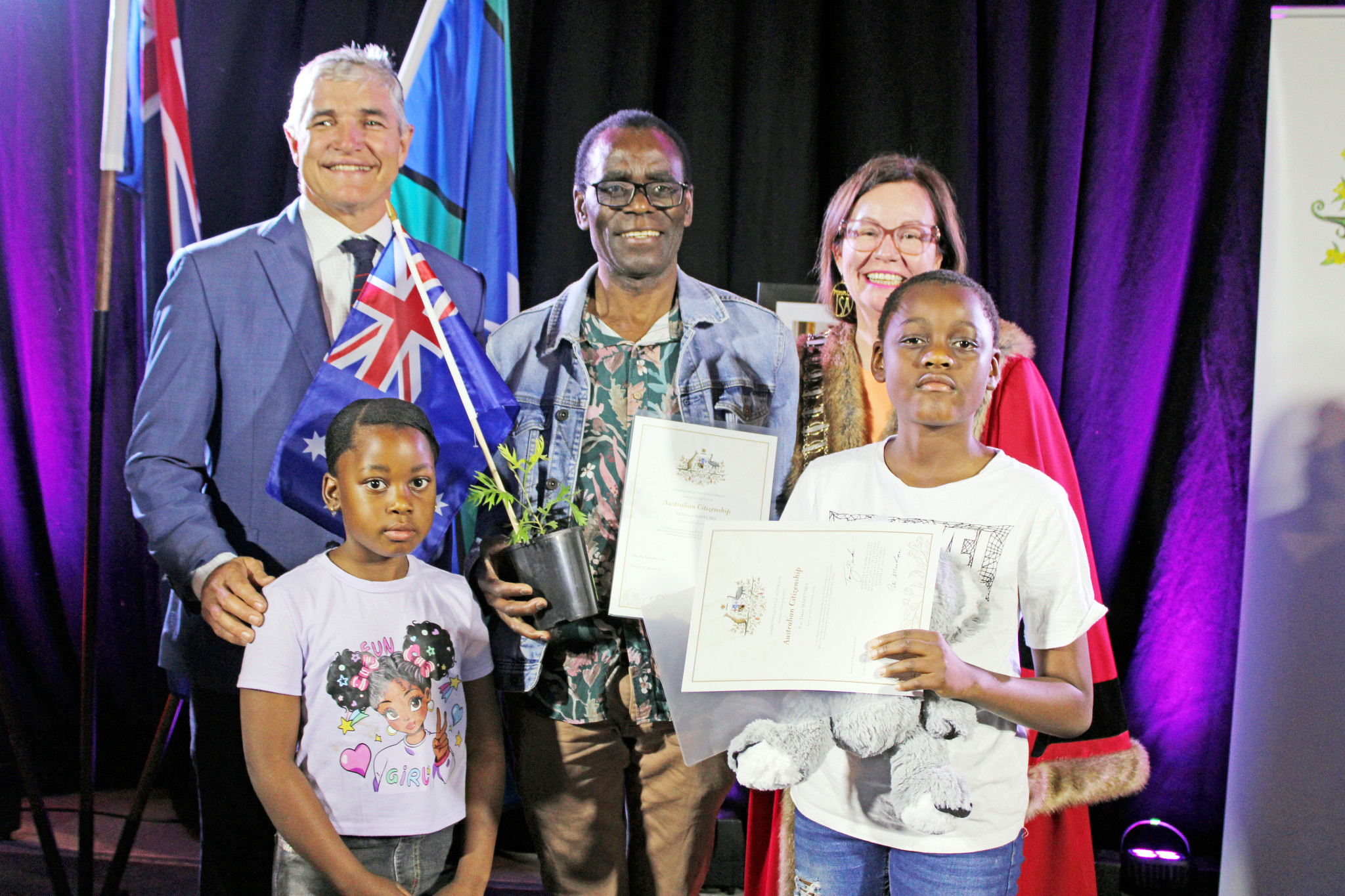 Phillimon Mapfumo and his children Tawana and Kai-Dane were presented their citizenship papers by Robbie Katter and Mount Isa mayor Peta MacRae.