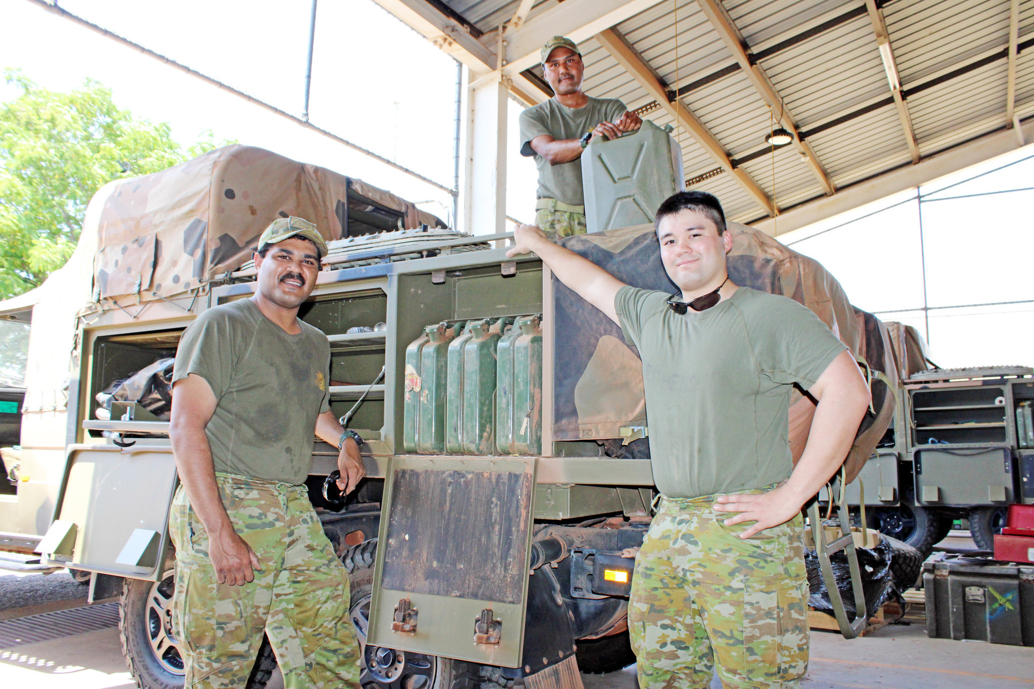 Private Llayton Major, Private Nathaniel Turner and Private Chris Stephens prepare the Army vehicle for the fortnight-long patrol in the Gulf.