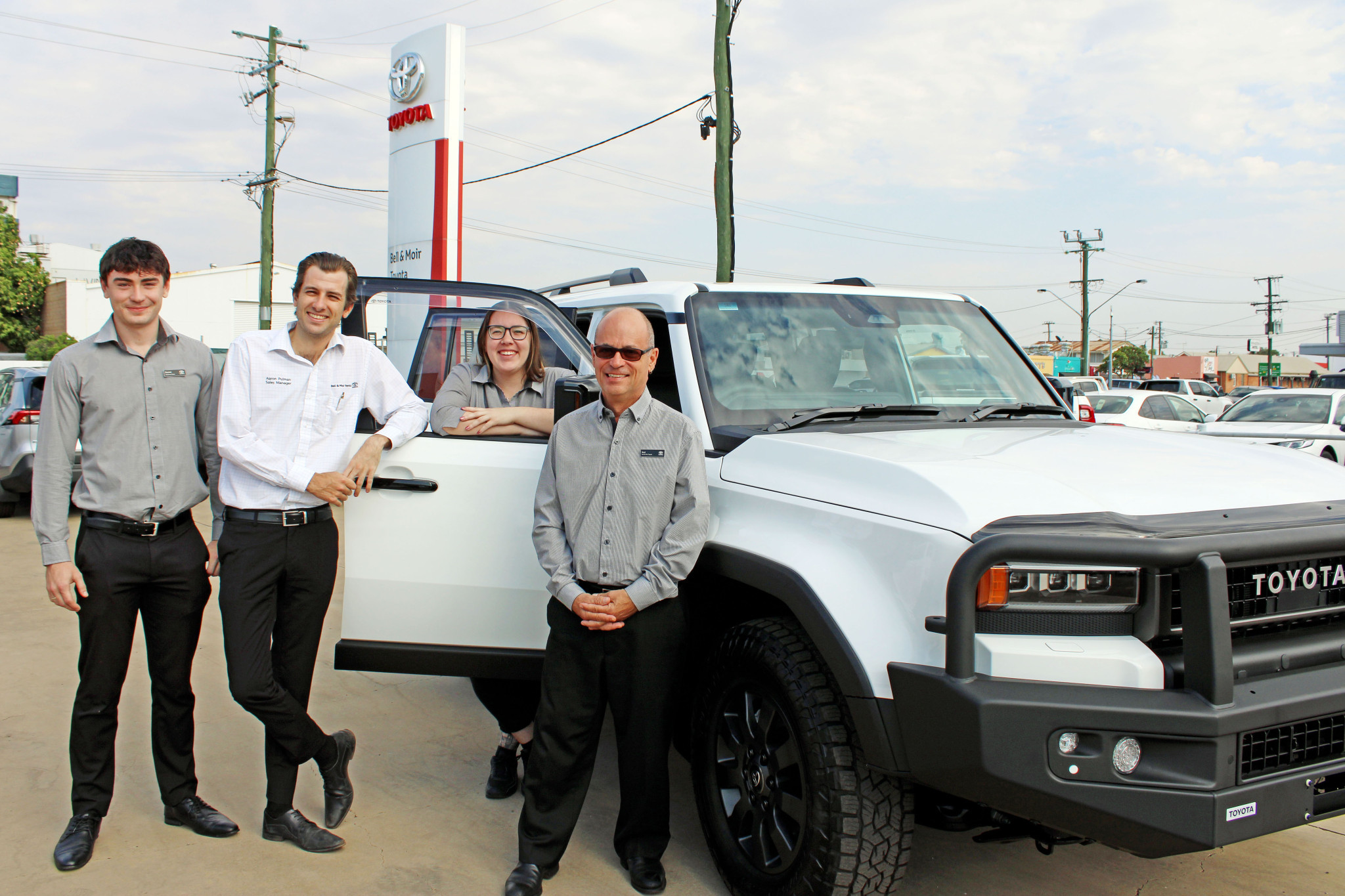 The Bell & Moir Toyota sales team in Mount Isa, led by Aaron Pulman (second from left), say that interest is already soaring in the new Toyota Prado.