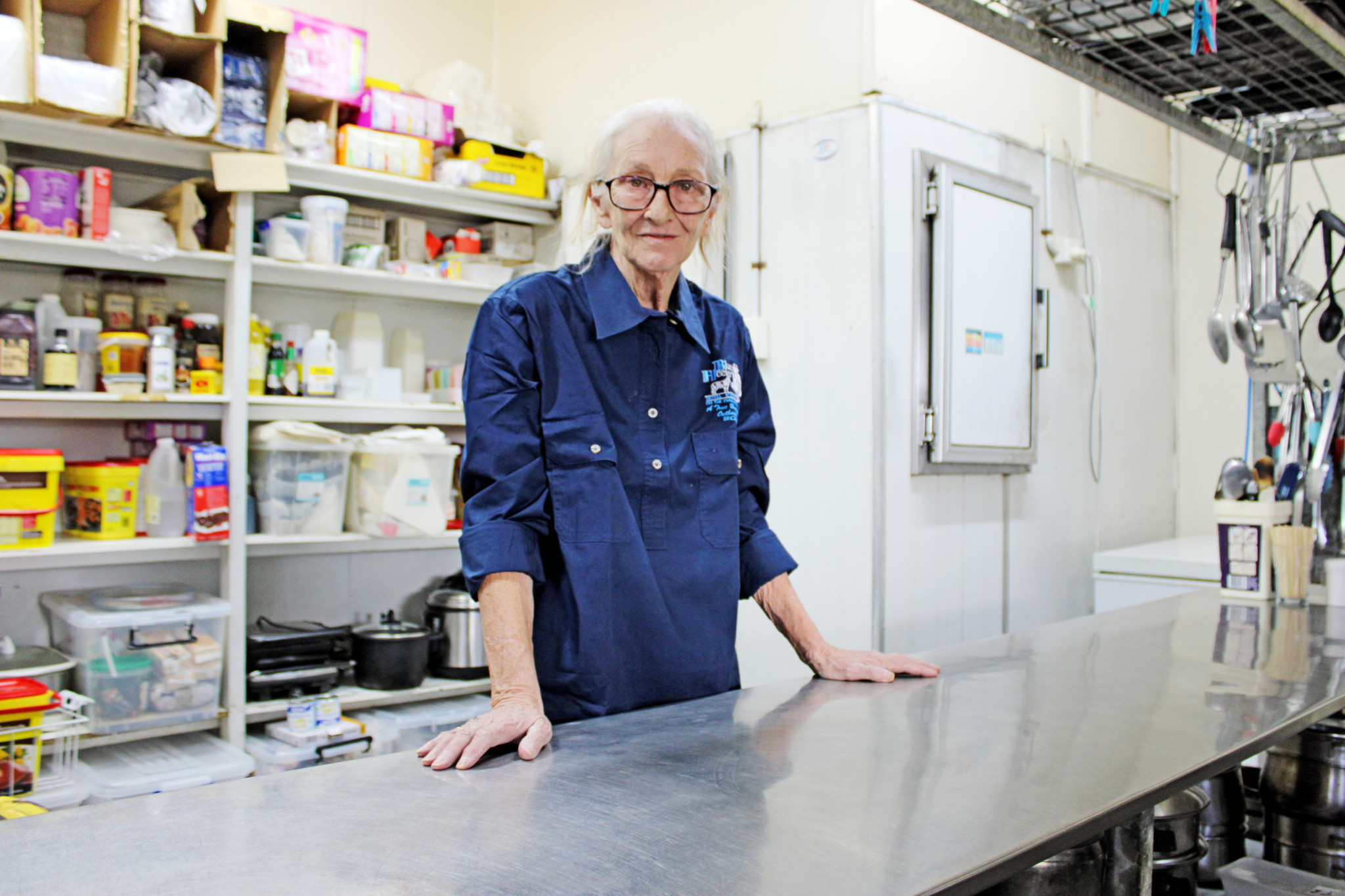 A newly clean and functioning kitchen at Kynuna’s famous Blue Heeler Hotel brings a smile to the face of Lorraine Pitt.