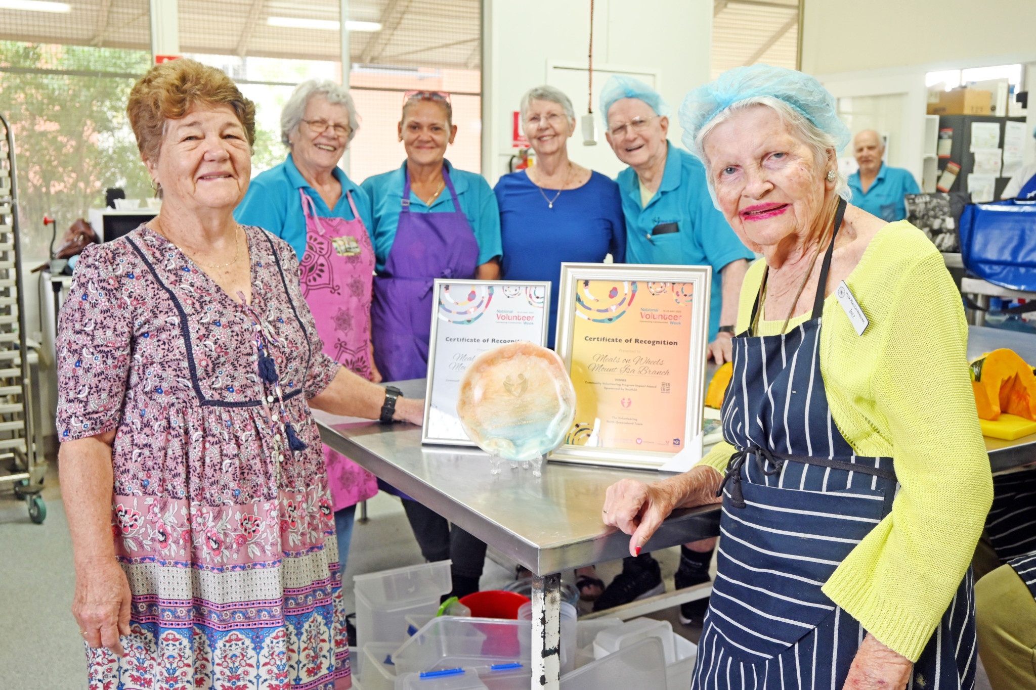 Mount Isa Meals on Wheels president Lucie Sanderson with Inez Bocos, who was awarded a certificate for 44 years of volunteer work from Prime Minister Anthony Albanese at her 90th birthday celebrations on Saturday, and fellow Mount Isa Meals on Wheels volunteers Kim Kjaergaard, Dallas McLean-Lovell, Beryl Dennis and Graham Brennan with the organisation’s recent National Volunteer Week awards.