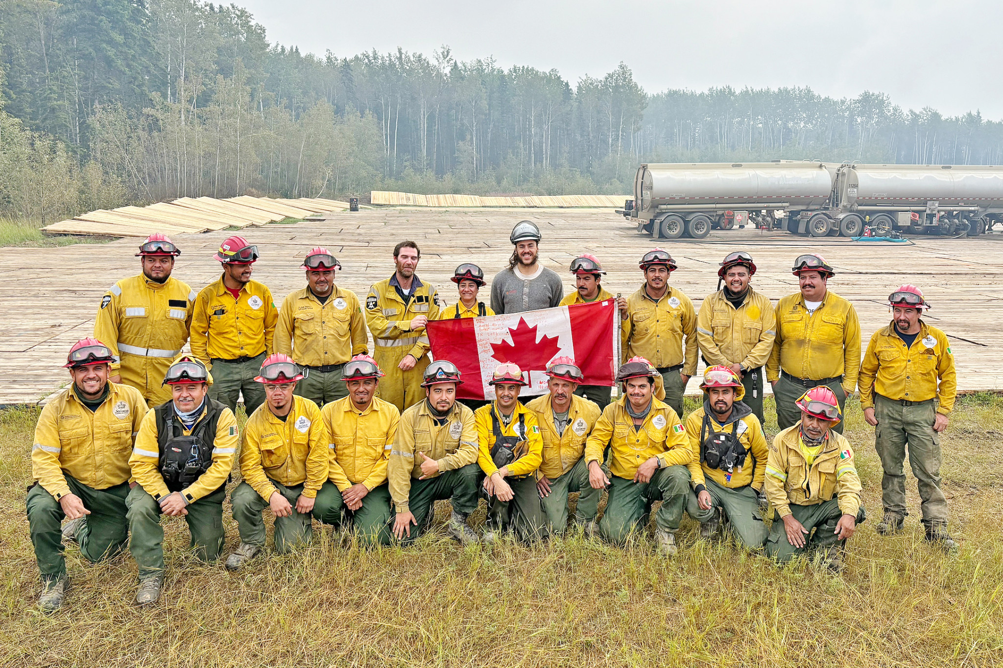 Gaven Bunker with the team of firefighters he worked alongside in Canada, including a group from Mexico.